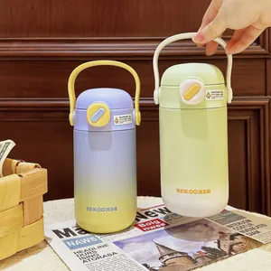 Detailed view of the frosted gradient stainless steel thermos bottle with portable handle design