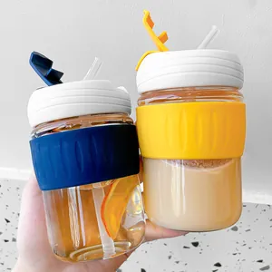 Minimalist glass coffee cups with protective silicone sleeves and straws, set of two mugs