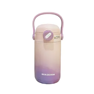 Gradient pink and purple insulated stainless steel water bottle with handle and straw lid