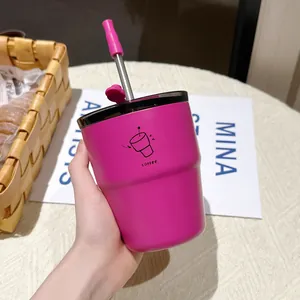 Vibrant hot pink stainless steel insulated coffee cup with straw and graphic detail