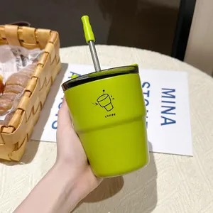 Close-up of a vibrant lime green stainless steel coffee cup with a reusable straw.