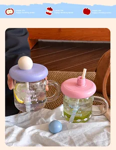 Detailed view of colorful dopamine glass mugs with straws and cute Better Me prints