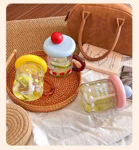 Vibrant dopamine color glass mugs with handles and lids displayed in lifestyle setting