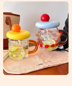 Colorful glass mug set with handle and straw, featuring 'Better Me is Coming' design and lids.