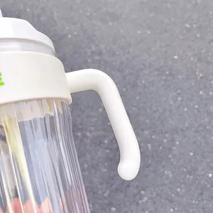 Detail view of a minimalist plastic straw cup with an ergonomic white handle.