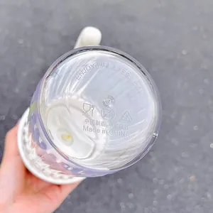Detailed close-up showing the bottom of a minimalist plastic water cup with safety marks
