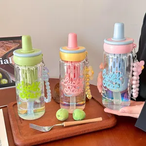 Three colorful aesthetic glass water bottles with straws, filters and cute bead charms