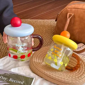 High-aesthetic dopamine glass cup with handle and straw for home and office.