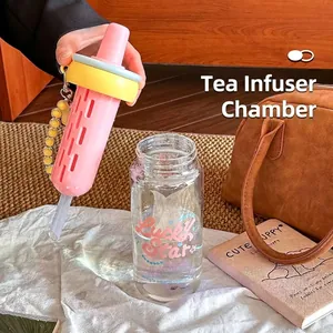 Transparent glass water bottle with pink tea infuser and straw for girls