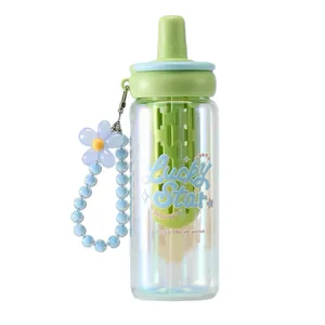 Pastel green glass water bottle with straw tea infuser and flower bead strap