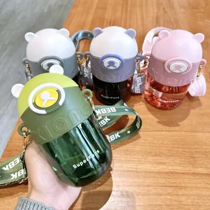 Close-up detail of cute bear-shaped Tritan straw water bottles in four vibrant colors
