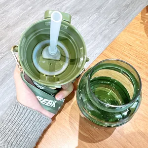 Detailed view showing the interior of the green Tritan water bottle lid and straw