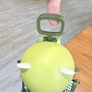 Detail of cute green ball-shaped kids water bottle showing portable handle