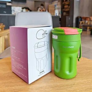 Minimalist 400ml green insulated coffee mug with pink lid and branded packaging box
