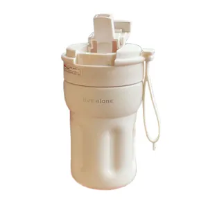Minimalist creamy white portable coffee cup with straw and carrying strap for daily travel