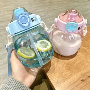 Close-up of two cute chubby water bottles with straw and portable strap detail
