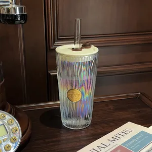 Macro view of iridescent wave pattern on heat-resistant glass coffee cup with lid