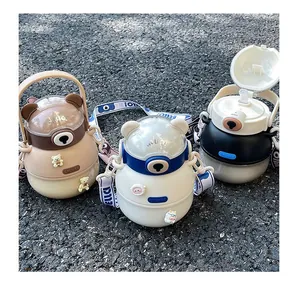 Detailed view of three cute bear-shaped portable water bottles for kids