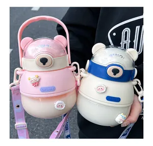 Two cute bear shaped portable plastic water bottles with shoulder straps in pink and white
