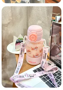 Gourde Tritan rose pour enfants avec paille et sangle, joli motif de chien de dessin animé.