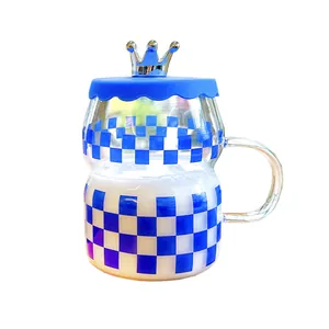 Klein blue glass mug with checkerboard pattern and silver crown lid for office use