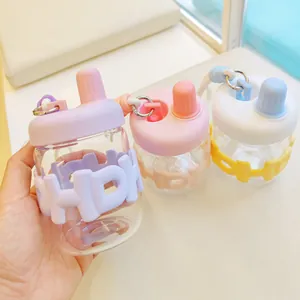 Bouteilles d'eau créatives en verre style biberon avec étuis en silicone pastel