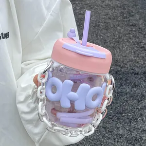 Close-up of a cute pink and purple water bottle with straw and white chain strap