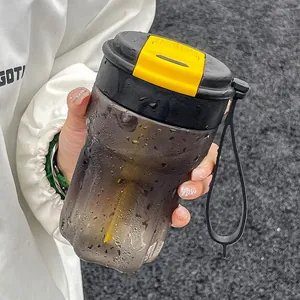 Portable black plastic coffee cup with straw yellow latch and refreshing water droplets