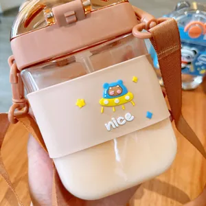 Close-up of portable square straw cup with cute cartoon bear silicone sleeve