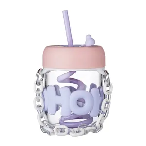 Minimalist cute pastel pink glass water bottle with straw and portable decorative chain