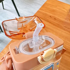Close-up of cute square plastic water bottle with flip-top lid and soft straw