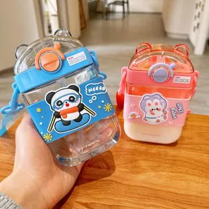 Close-up of cute panda and rabbit square straw water bottles with straps and bear ear lids.