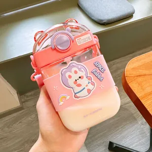 Close-up of a pink cartoon square straw water bottle featuring a cute rabbit sticker