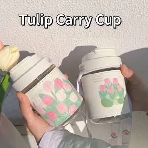 Ins-style portable glass water bottle with elegant tulip floral sleeve and strap