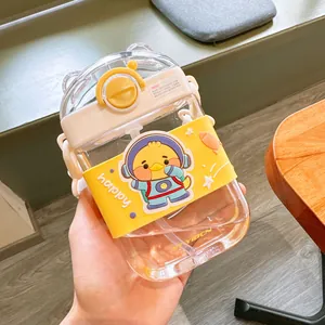 Close-up of cute cartoon square straw bottle with astronaut chick silicone sleeve detail