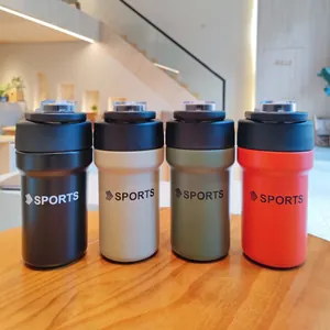 Four colorful stainless steel sports insulated water bottles displayed on a wooden table