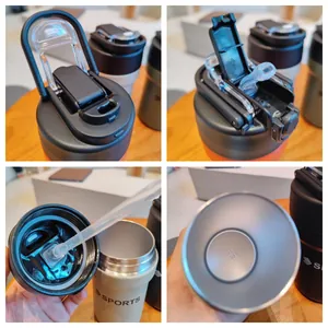 Minimalist stainless steel insulated sports water bottle with straw and handle detail view