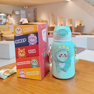 Botella de agua térmica infantil de dinosaurio con caja de embalaje de colores vivos