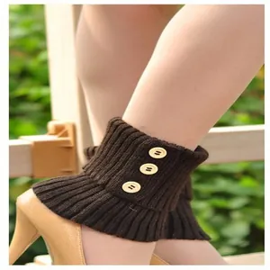 Detail view of stylish brown cable knit leg warmers featuring three decorative wooden buttons