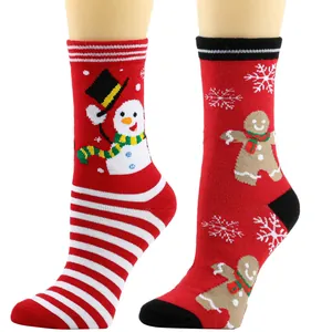 Close-up of festive Christmas socks featuring snowman and gingerbread man designs