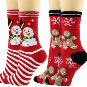 Close-up of festive Christmas socks featuring cute snowman and gingerbread man patterns.