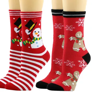 Detailed view of festive red Christmas socks featuring cute snowman and gingerbread man patterns