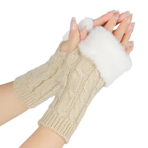 Close-up detail of beige cable knit fingerless gloves featuring soft white faux fur trim.