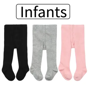 Three pairs of soft cotton baby footed leggings in black, gray, and pink