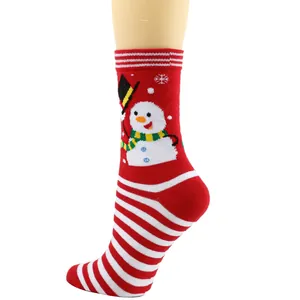 Close-up of festive Christmas mid-calf socks with cute snowman and striped pattern