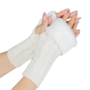 Detailed view of white cable knit fingerless gloves with luxurious faux fur trim details