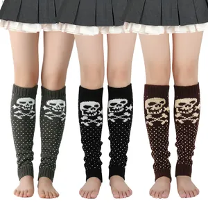 Close-up of knitted skull leg warmers in black, grey, and brown colors