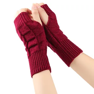 Detailed view of wine red fingerless knitted gloves featuring a diamond pattern texture