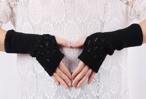 Detailed view of women black hollow knit fingerless arm warmers with lace pattern