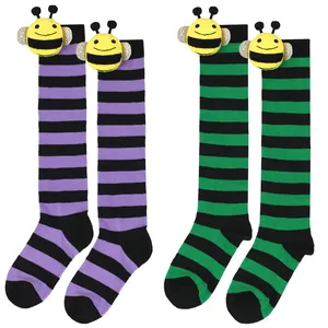 Striped knee-high socks for kids featuring cute 3D bee doll attachments in purple and green